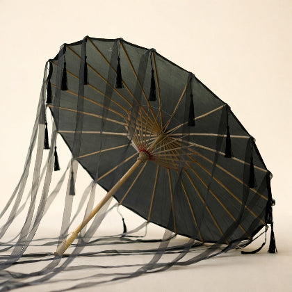 Traditional black parasol with tassels