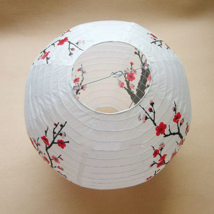 White paper lantern with cherry blossom design
