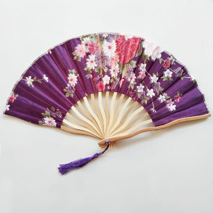 Floral-patterned hand fan with purple accents 