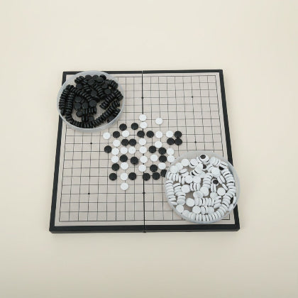 Go game board with black and white stones 