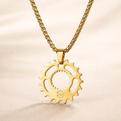 Gold gear-shaped pendant on a chain a