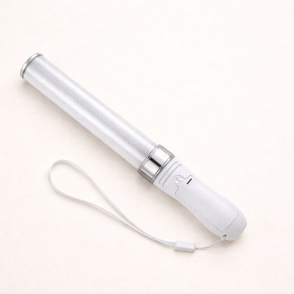 White glow stick with a strap